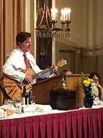 Michael J. Babb Strumming a Guitar